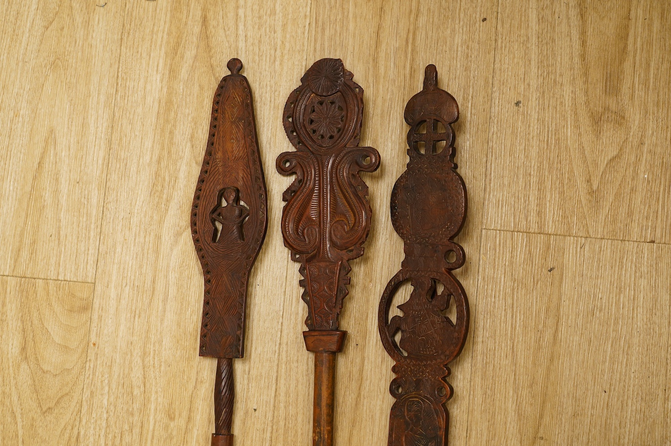 Three 19th century Russian or Eastern European treen distaffs, longest 77cm. Condition - fair to good, one with missing bottom section